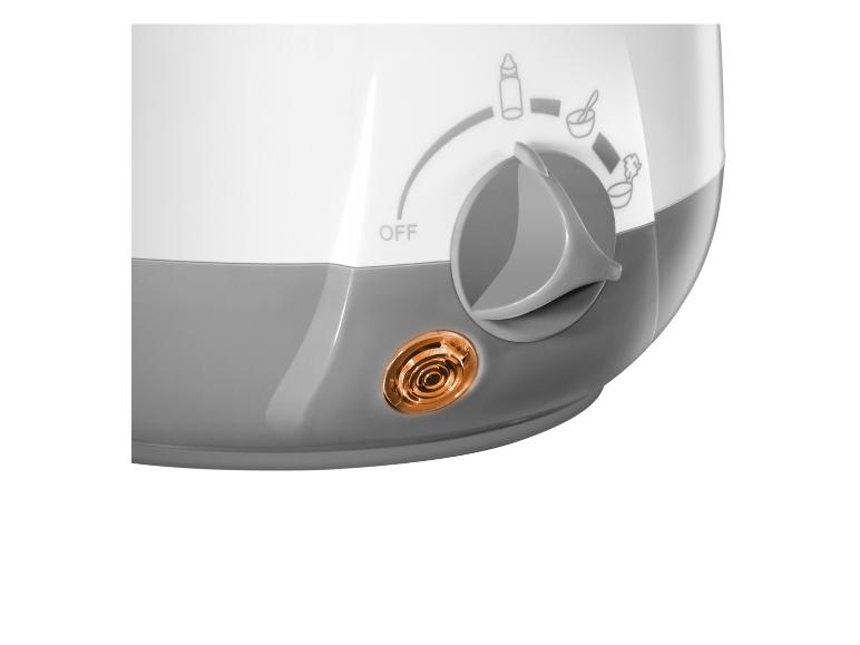 Chauffe-biberon blanc et gris avec bouton de réglage pour biberons et petits pots, lumière orange allumée.