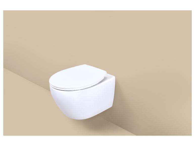 Toilettes blanches suspendues sur fond beige