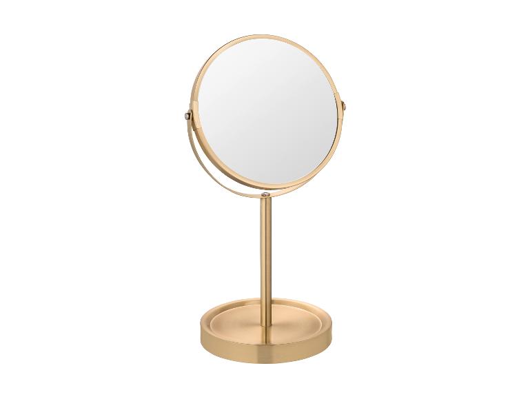 Miroir de table doré avec cadre rond.