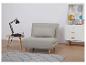 Canapé-lit beige, table basse et commode design moderne.