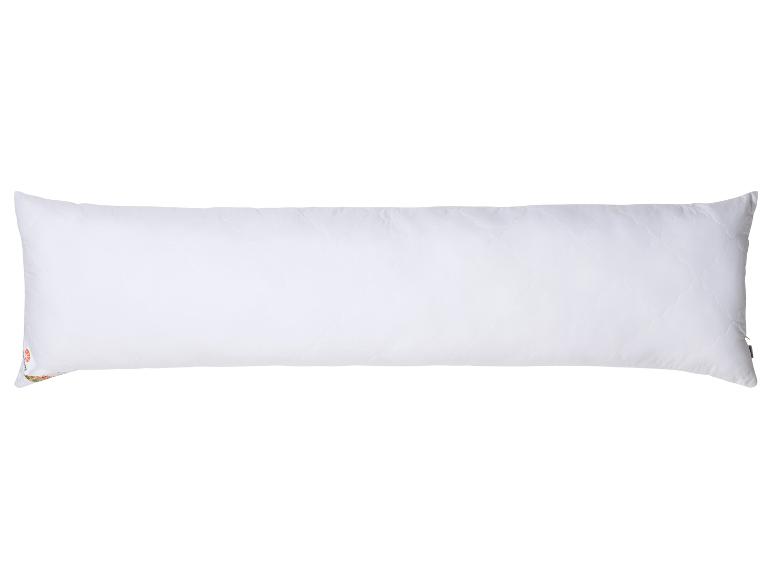 Un grand oreiller blanc avec fermeture éclair.