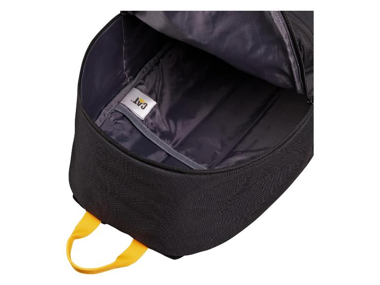 Intérieur d'un sac à dos noir avec une poignée jaune et une étiquette blanche
