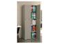 Armoire de classement grise avec portes ouvertes, révélant des classeurs colorés et des livres.