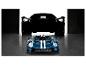 Une voiture Ford GT et un modèle Lego Technic Ford GT dans un garage.