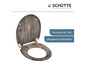 Une lunette de toilette avec un motif en bois de Schütte.