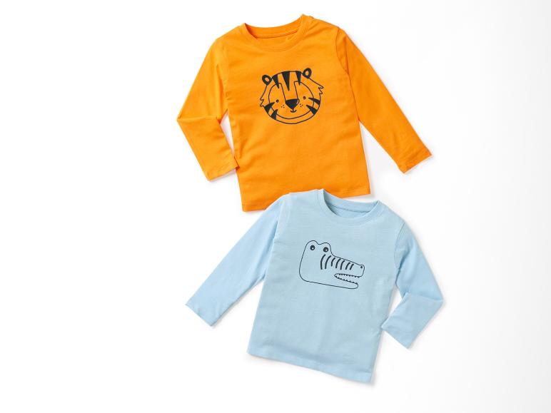 Deux t-shirts à manches longues pour enfants : un orange avec un tigre et un bleu avec un crocodile.