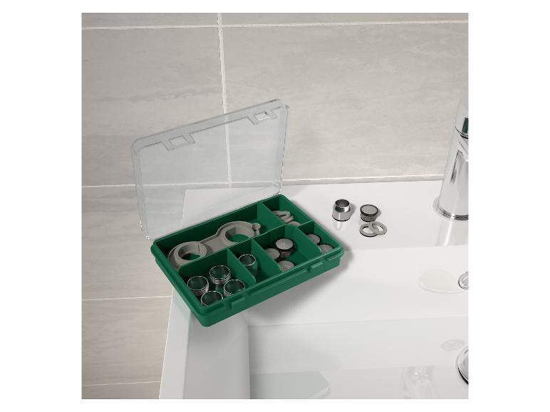 Kit de réparation de robinet dans une boîte verte.