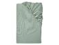 Drap-housse vert clair plié avec élastique