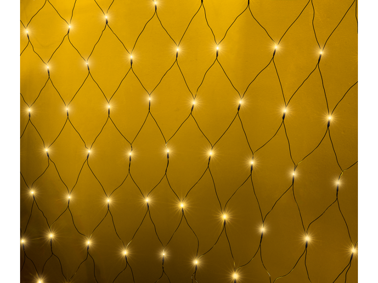 Guirlande lumineuse LED filet blanc chaud créant une lueur festive sur un fond doré.