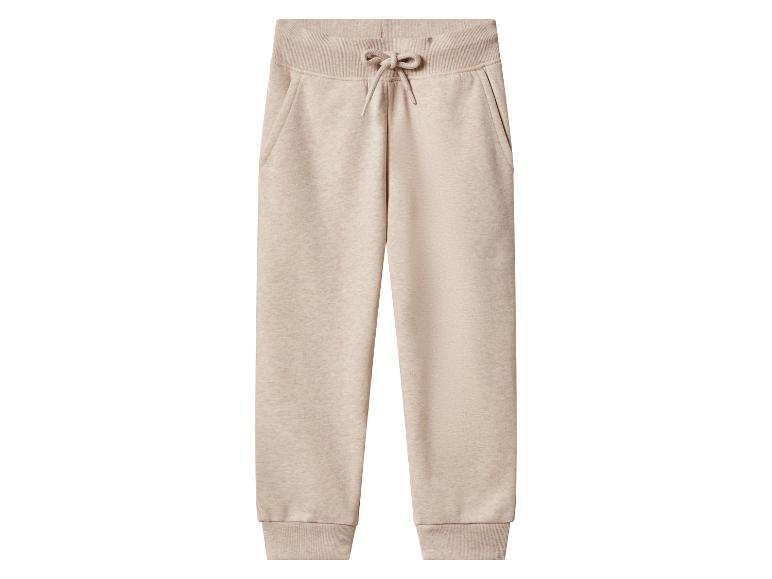 Pantalon de jogging beige avec cordon de serrage à la taille et poignets côtelés.