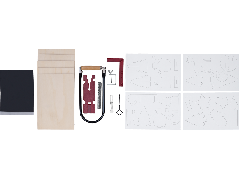 Kit de bricolage avec planches en bois, outils et pochoirs de Noël.