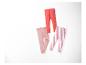 Leggings rose, rouge et rayés rouge et blanc pour enfant.