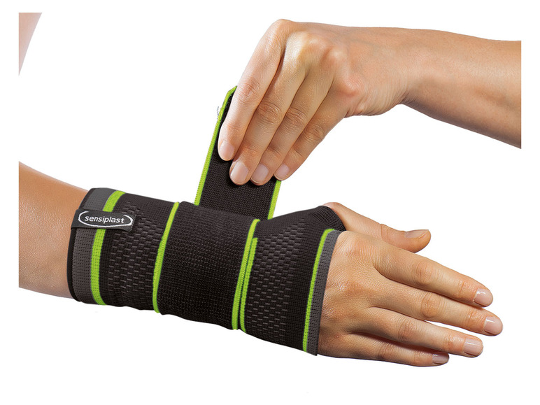 Un bracelet de poignet noir de Sensiplast avec des accents verts.