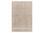 Serviette de bain beige en coton éponge.