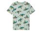 Un t-shirt vert clair avec des dinosaures dans des voitures de course