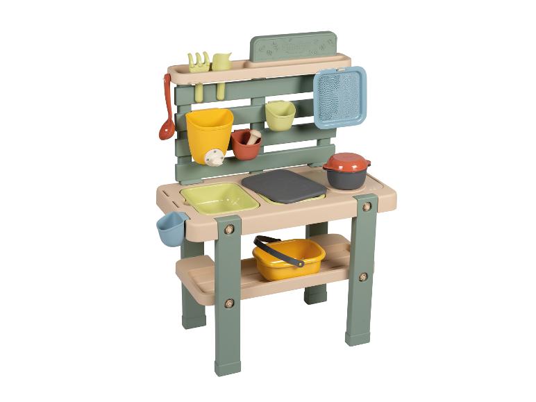 Cuisine de jeu Smoby verte et beige avec ustensiles et accessoires.