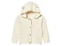 Un cardigan en tricot blanc à capuche pour bébés