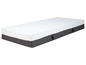 Un matelas blanc avec un dessous gris.