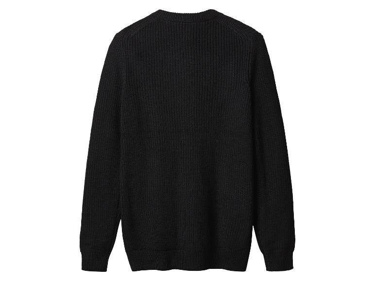 Pull noir en tricot à manches longues et col rond, vue de dos.