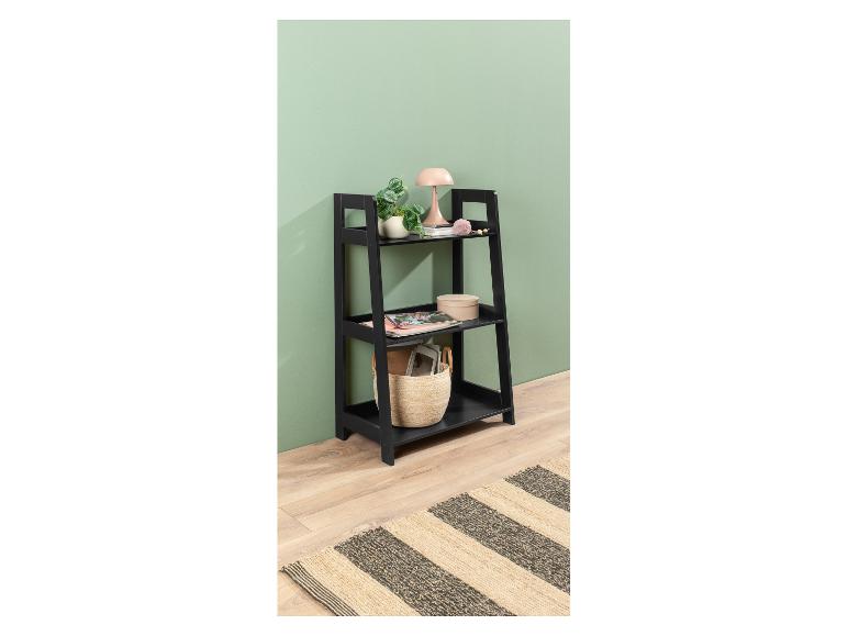 Étagère noire à trois niveaux décorée dans un style moderne.