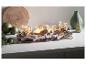 Décoration de Noël avec des bougies allumées dans des pots en verre, des branches de bois et une inscription 'Merry Christmas'.