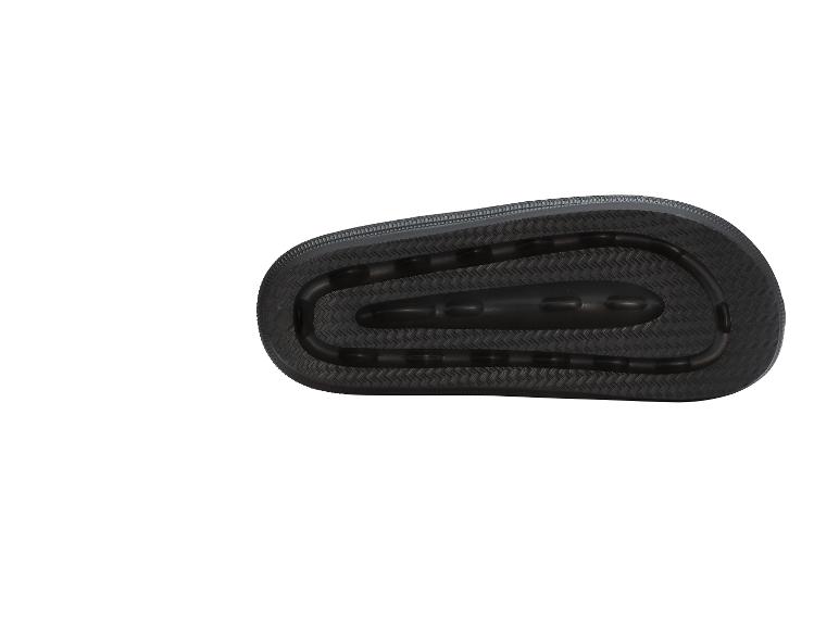 Tapis d'exercice noir avec motif en relief.