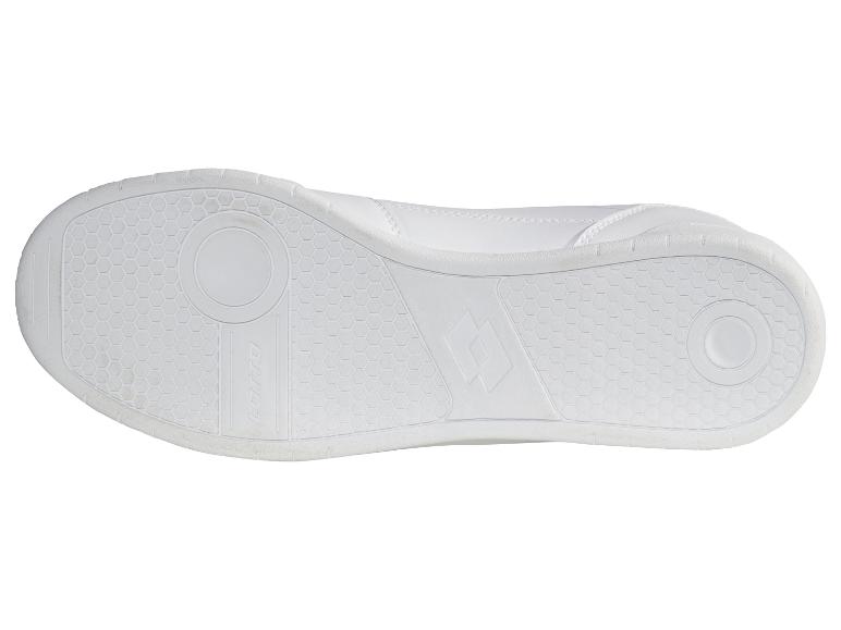 Semelle blanche d'une chaussure de sport avec motif hexagonal et détails circulaires.