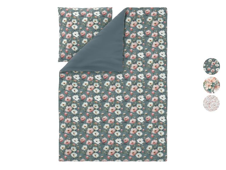 Parure de lit housse de couette et taie d'oreiller à motif floral rose et blanc.