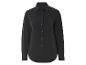 Chemise noire à manches longues, style minimaliste.