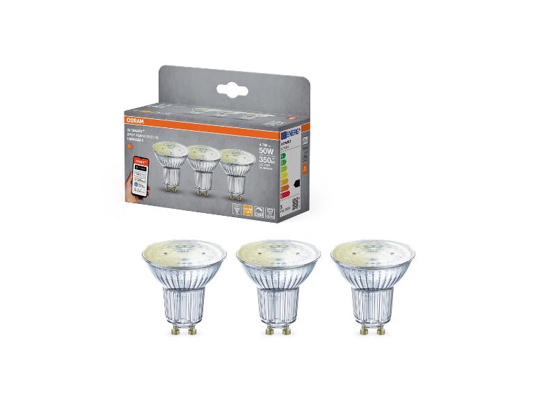Trois spots LED GU10 intelligents et dimmables dans leur emballage, avec spécifications et intégration d'application.