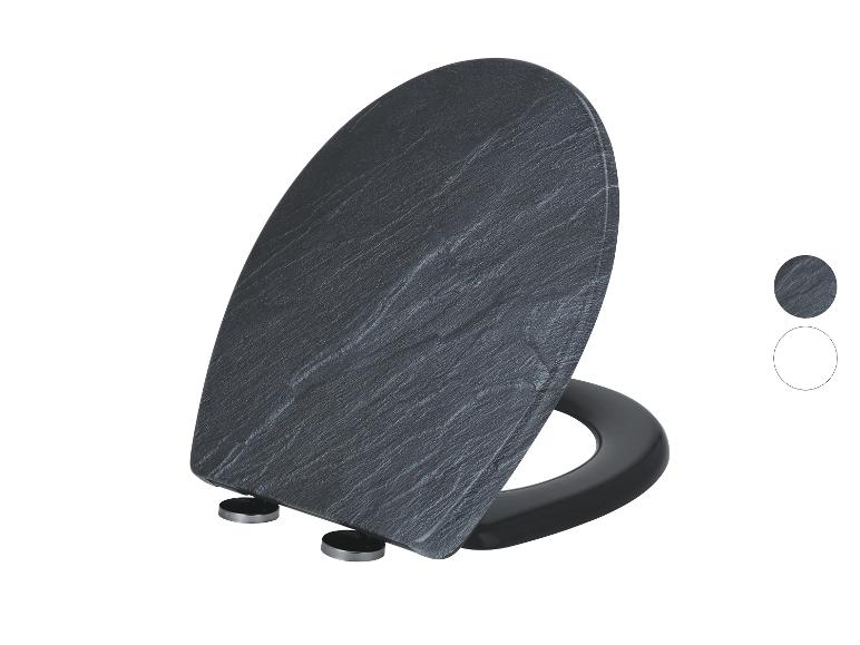 Abattant de toilettes effet ardoise gris foncé avec anneau noir et charnières argentées.
