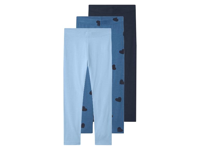 Lot de 3 leggings pour enfants dans des tons de bleu, un avec motif cœurs.
