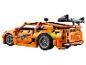 Voiture LEGO Technic Fast & Furious, orange, avec des détails verts et un aileron.