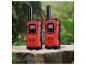 Deux talkie-walkies Bresser Junior rouges sur une souche d'arbre.