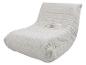 Chaise longue beige avec texture textile et plis