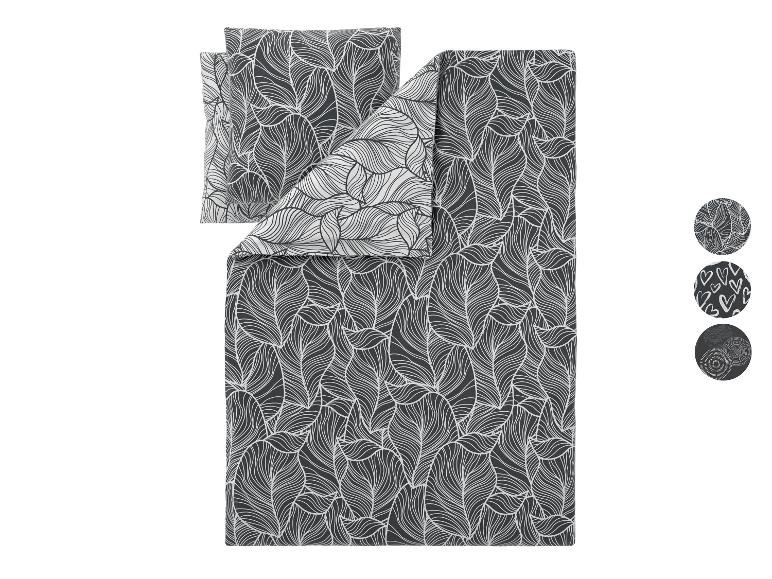 Parure de lit avec fond gris foncé et motif de feuilles blanches, avec trois échantillons circulaires montrant des motifs alternatifs.