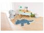Un tapis de dinosaure bleu dans une chambre d'enfant