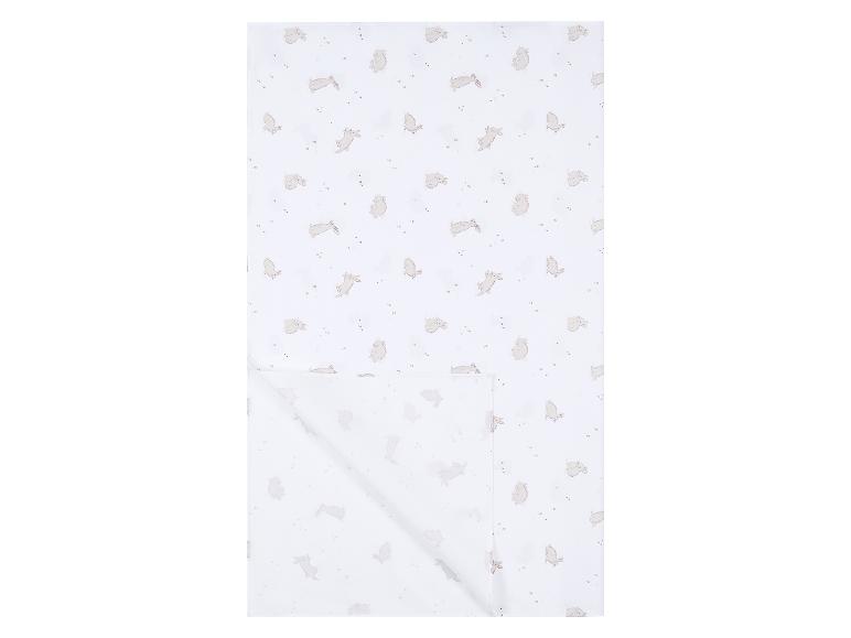 Drap de lit blanc avec un motif de lapins beiges et de petites étoiles.