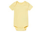 Un body bébé jaune à manches courtes.