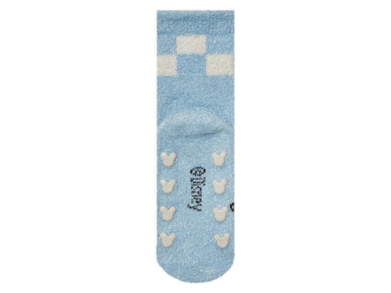 Des chaussettes bleues avec un motif Mickey Mouse.
