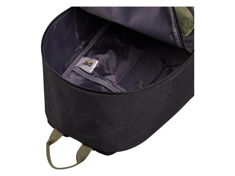 Intérieur d'un sac à dos noir ouvert avec doublure grise et étiquette blanche.