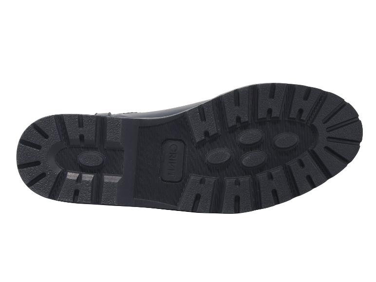 La semelle d'une paire de bottes en cuir bleues de la marque Crivit.
