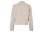 Pull beige à manches longues et col montant.