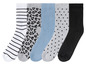 Six paires de chaussettes avec différents motifs, y compris des rayures, des pois et un imprimé léopard.