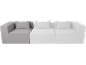 Canapé modulaire trois places avec coussins, un module gris et deux blancs.