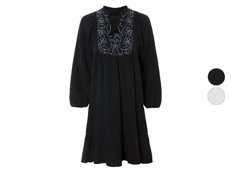Robe noire à manches longues, style bohème, avec broderies.