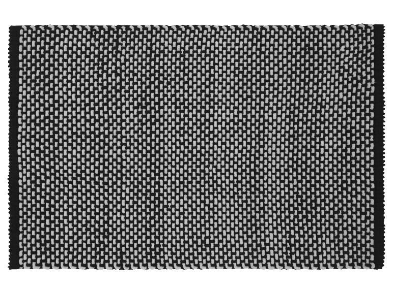Tapis design géométrique noir et blanc.