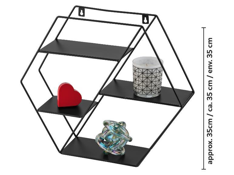 Étagère murale hexagonale en métal noir avec décorations, environ 35 cm de haut.