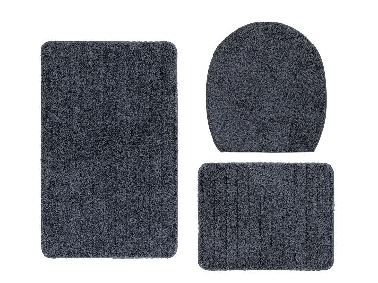 Un ensemble de tapis de bain avec un tapis rond pour les toilettes, un tapis rectangulaire et un tapis rectangulaire plus petit.