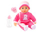Une poupée bébé rose avec une sucette, un biberon et un ours sur ses vêtements.